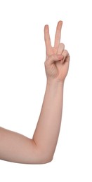 Photo of Playing rock, paper and scissors. Woman making scissors with her fingers on white background, closeup