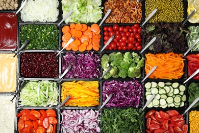 Photo of Salad bar with different fresh ingredients as background, top view