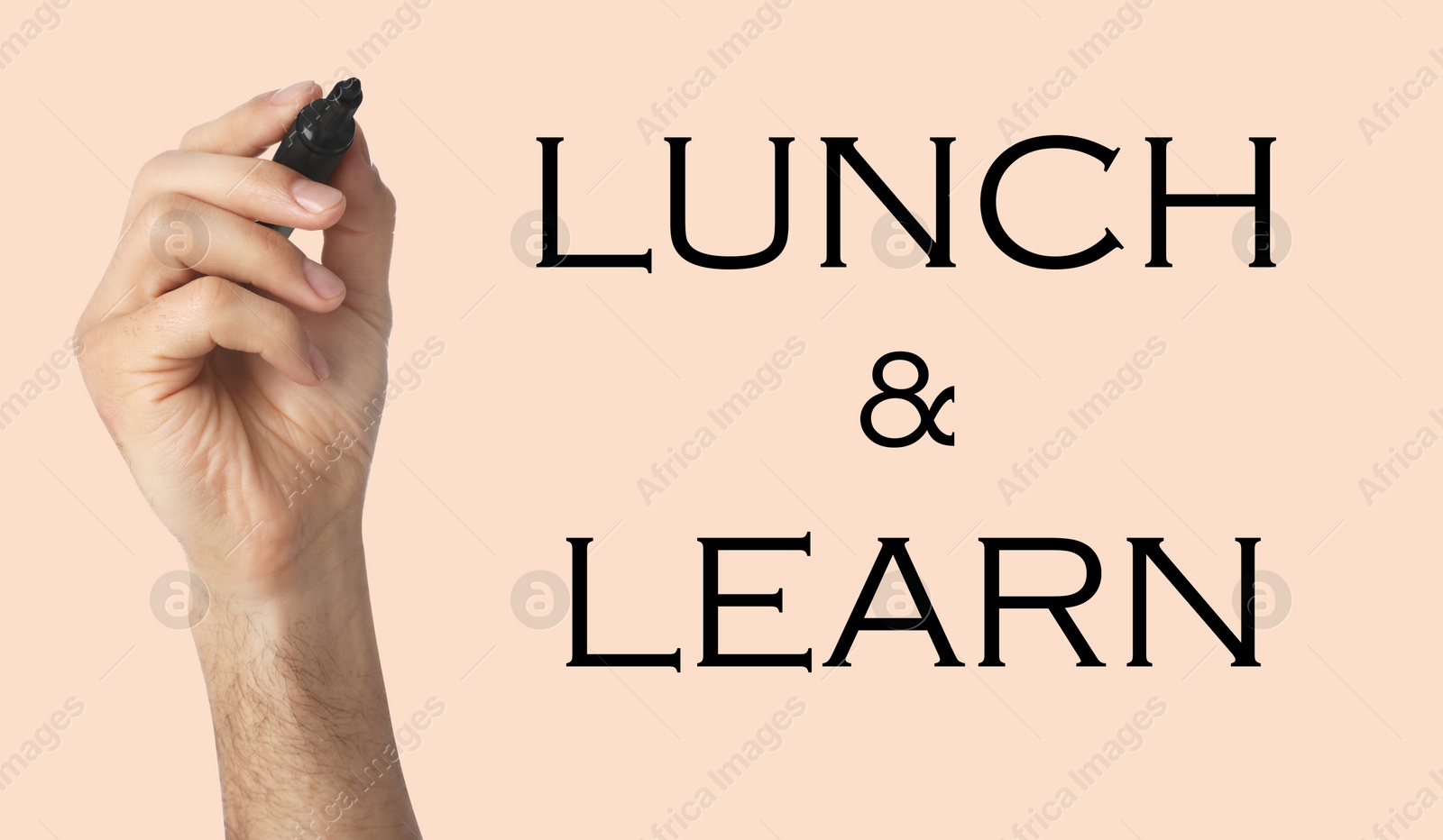 Image of Lunch and Learn concept. Man with marker on beige background, closeup