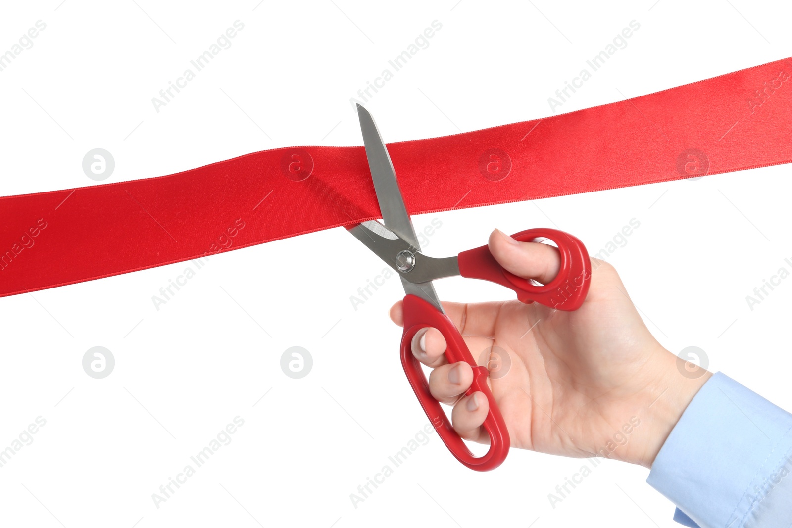 Photo of Woman cutting red ribbon on white background, closeup