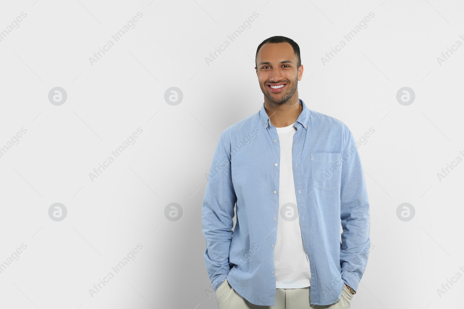 Photo of Portrait of handsome young man on white background, space for text