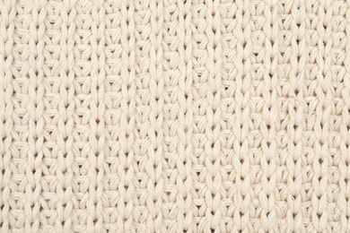 Photo of Texture of cozy warm sweater as background, closeup