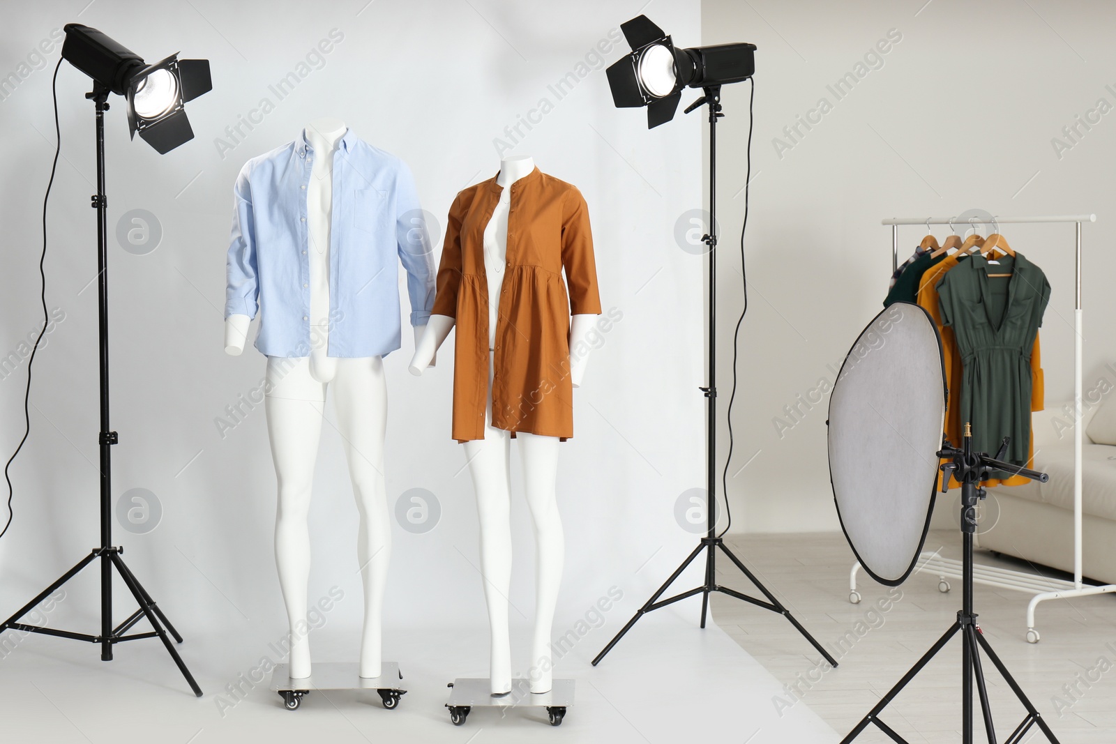Photo of Ghost mannequins with modern clothes in professional photo studio