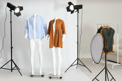 Photo of Ghost mannequins with modern clothes in professional photo studio