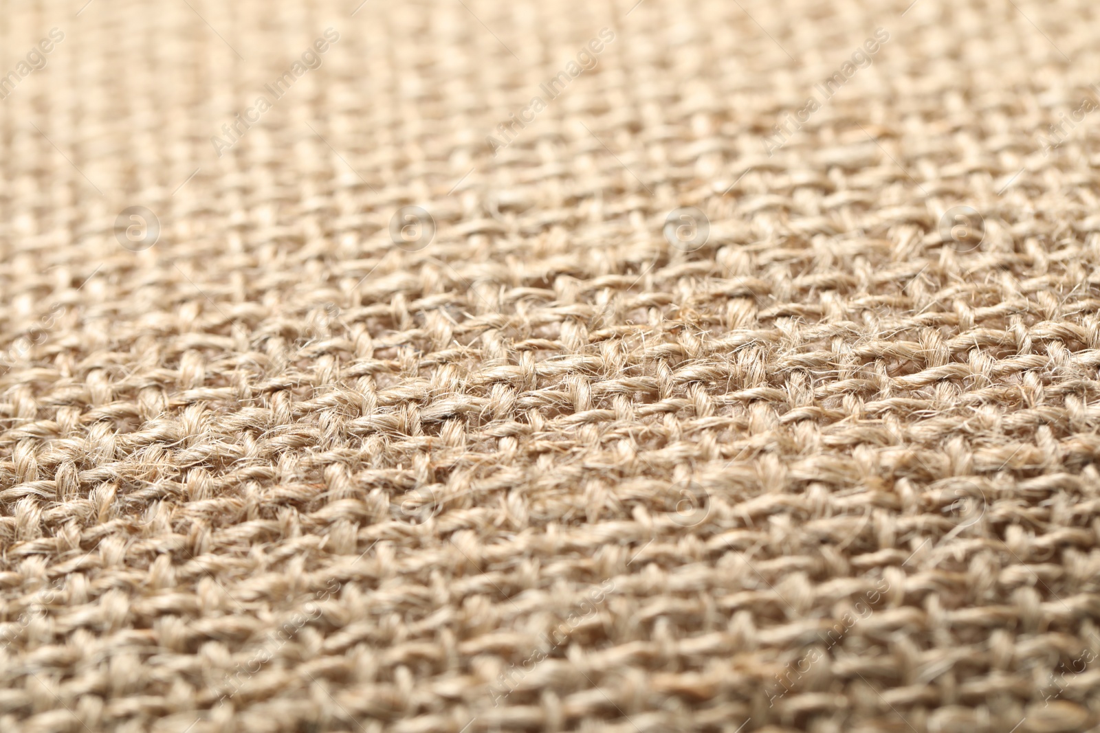 Photo of Texture of beige fabric as background, closeup