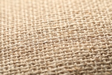 Photo of Texture of beige fabric as background, closeup
