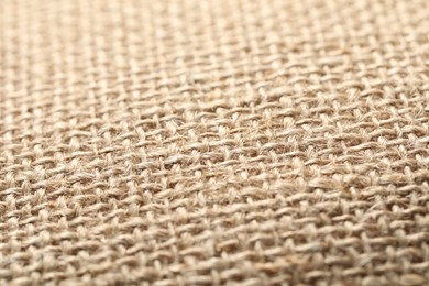 Texture of beige fabric as background, closeup