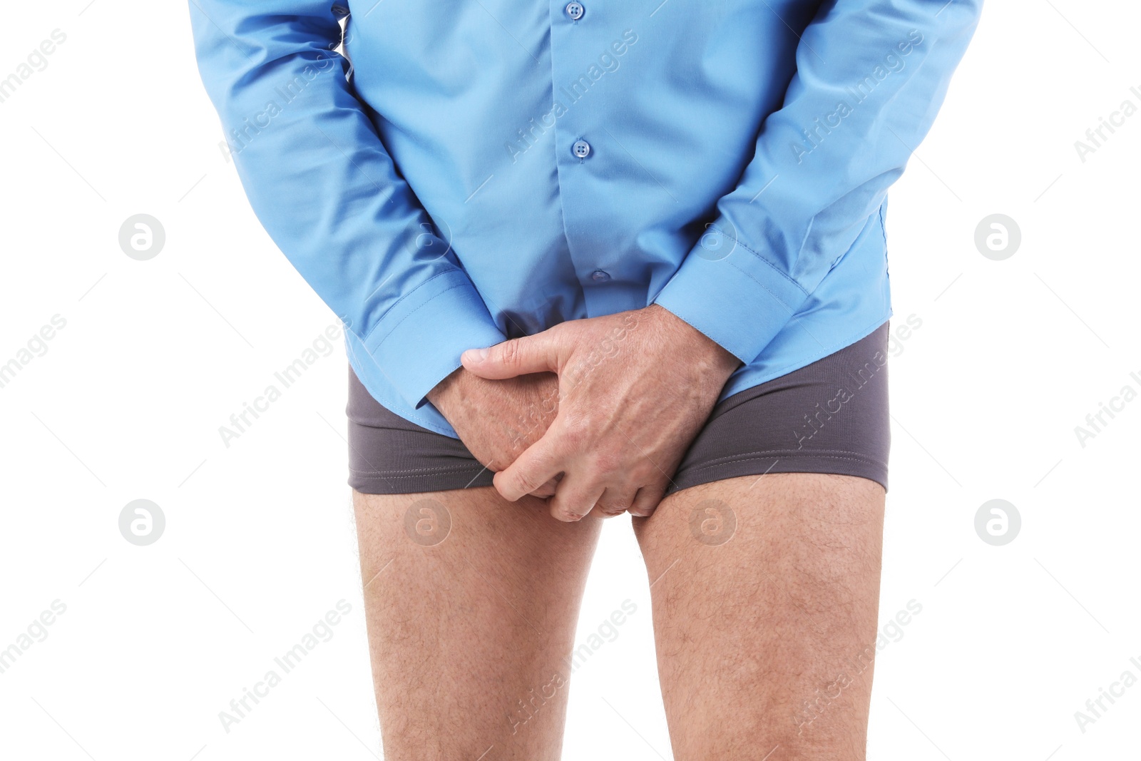 Photo of Mature man with urological problems suffering from pain on white background