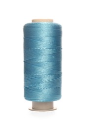 Photo of Spool of light blue sewing thread isolated on white