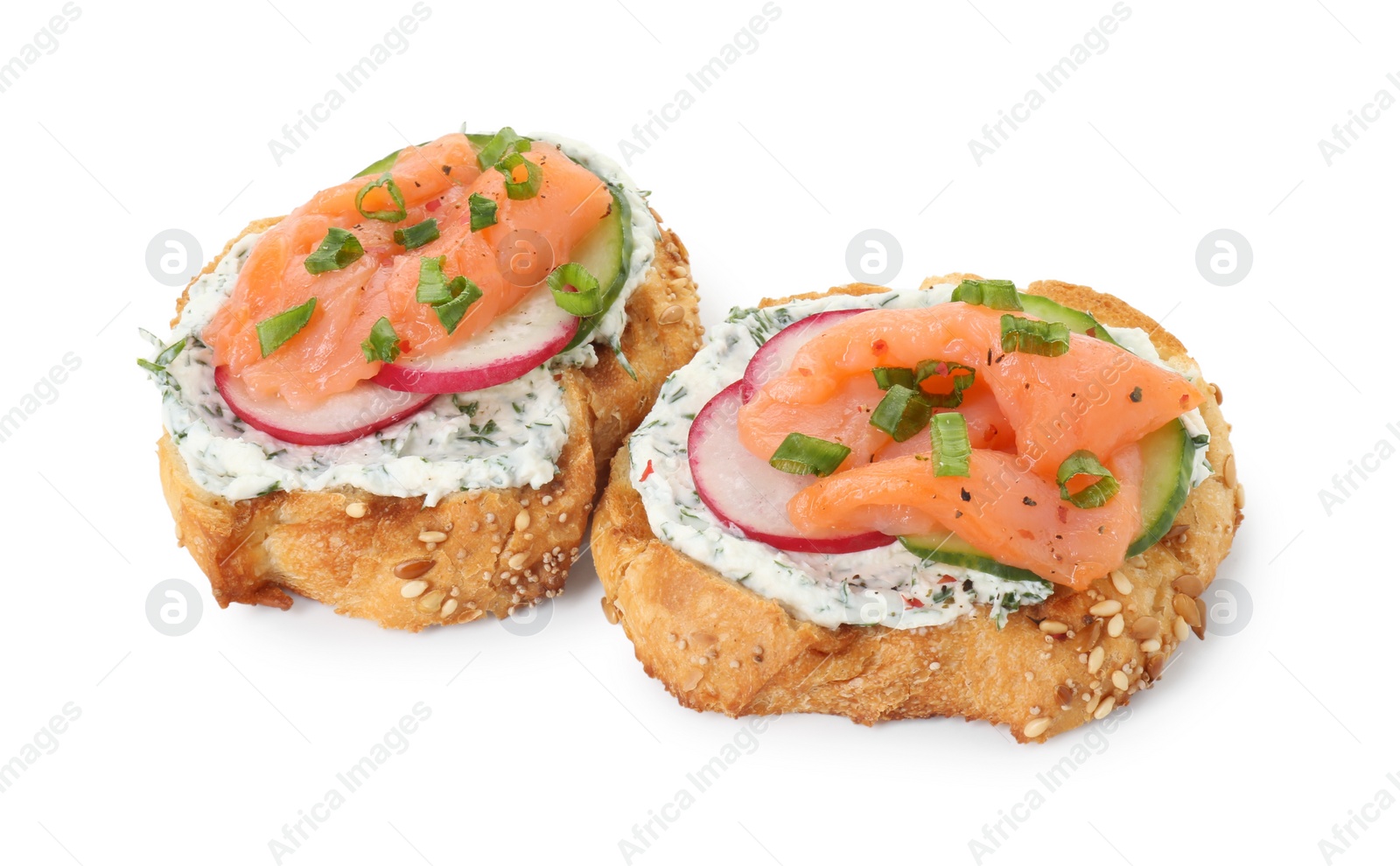 Photo of Tasty canapes with salmon, cucumber, radish and cream cheese isolated on white