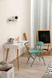 Photo of Modern child room interior with stylish furniture