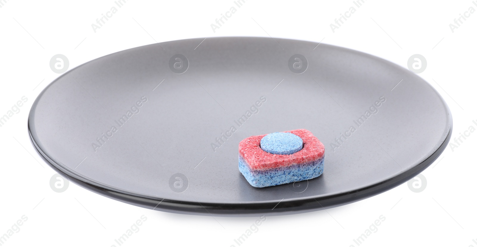 Photo of Grey plate with dishwasher detergent tablet on white background