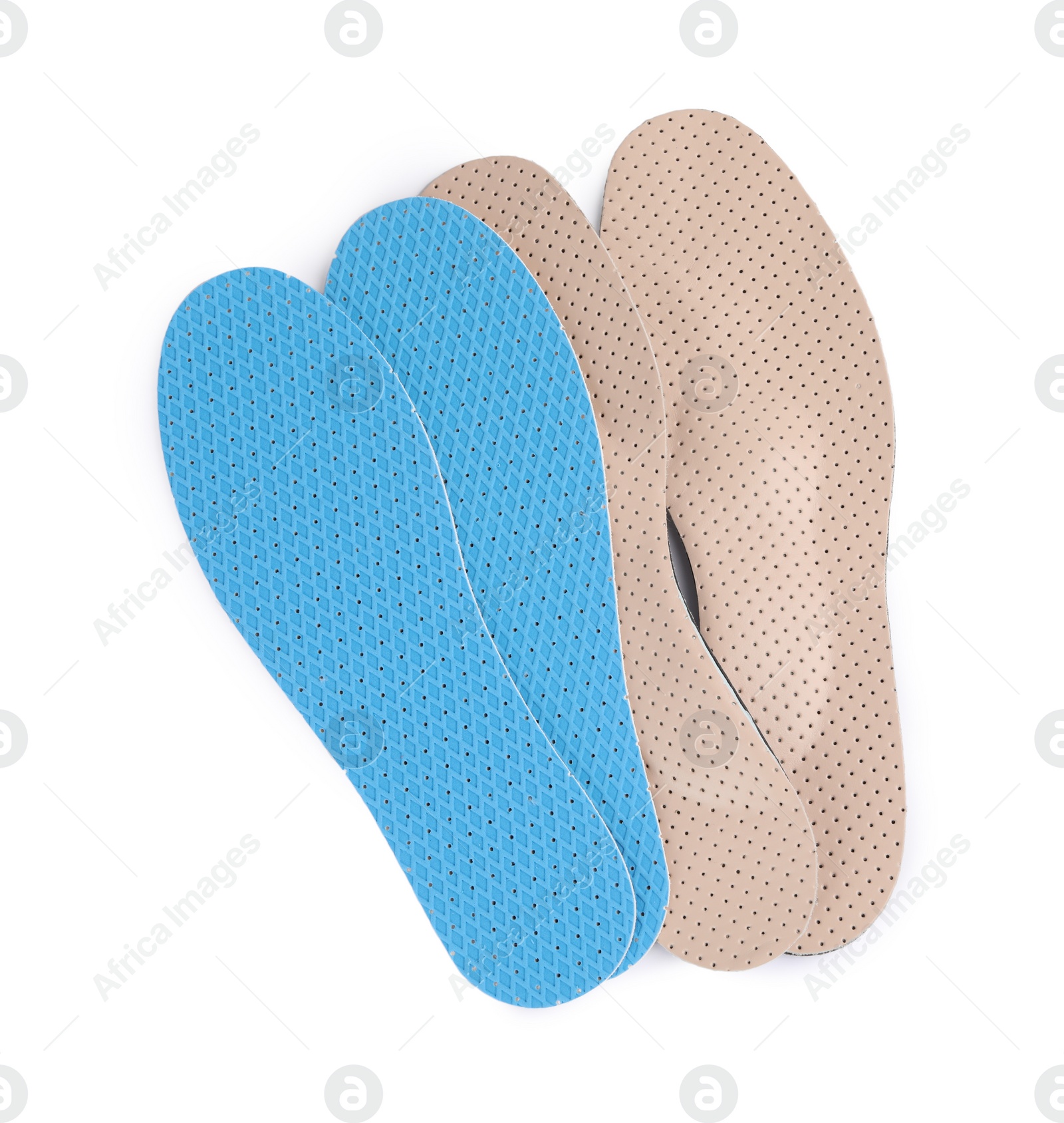 Photo of Pairs of insoles on white background, top view