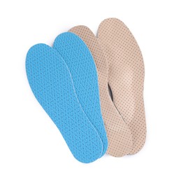 Photo of Pairs of insoles on white background, top view