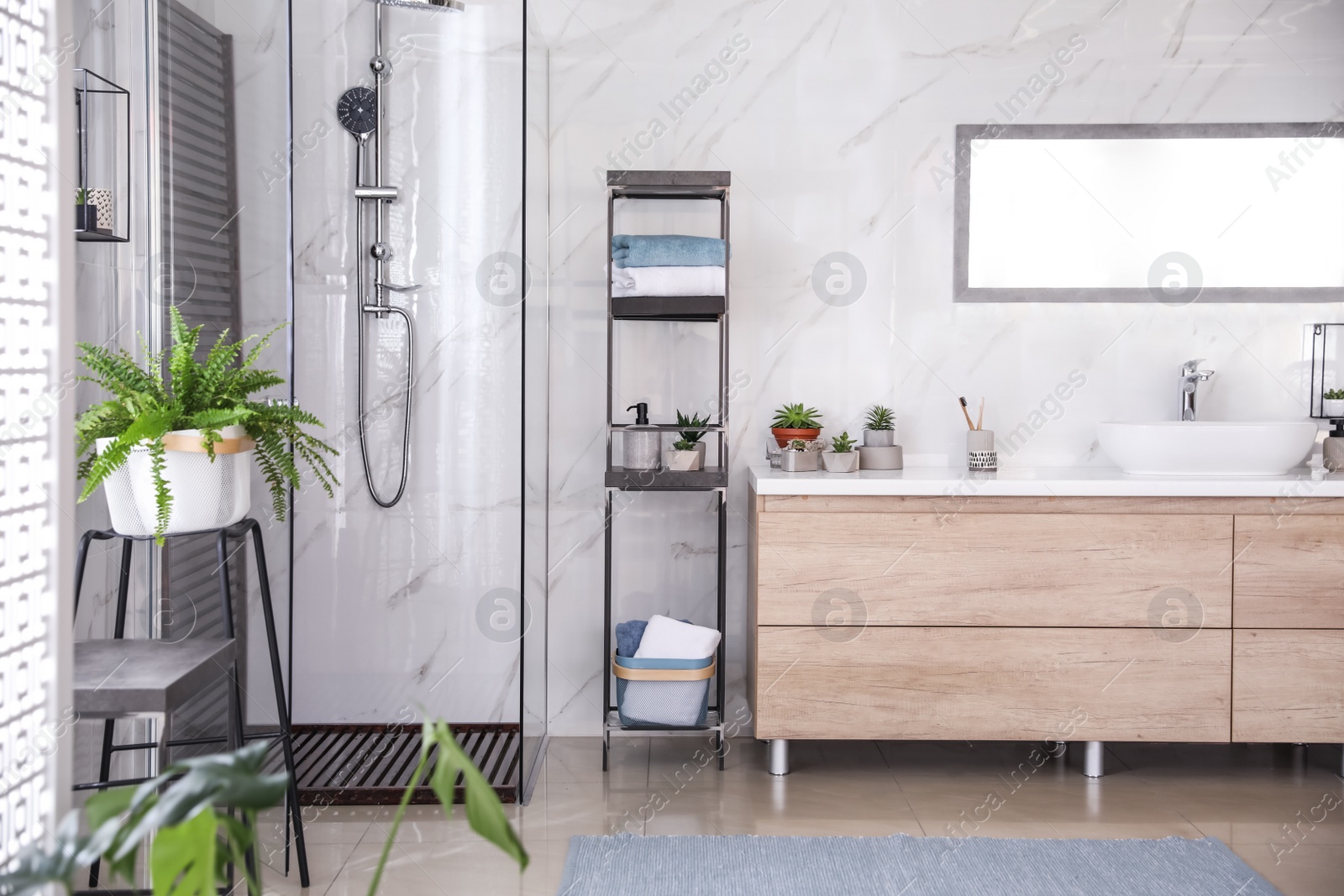 Photo of Bathroom interior with shower stall and counter. Idea for design