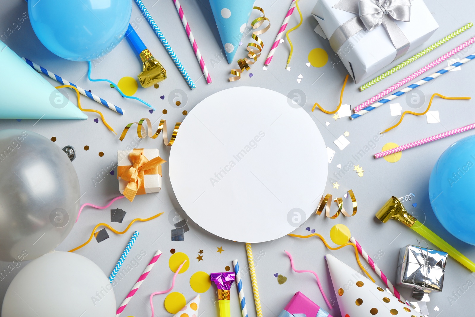 Photo of Flat lay composition with party accessories and space for text on grey background