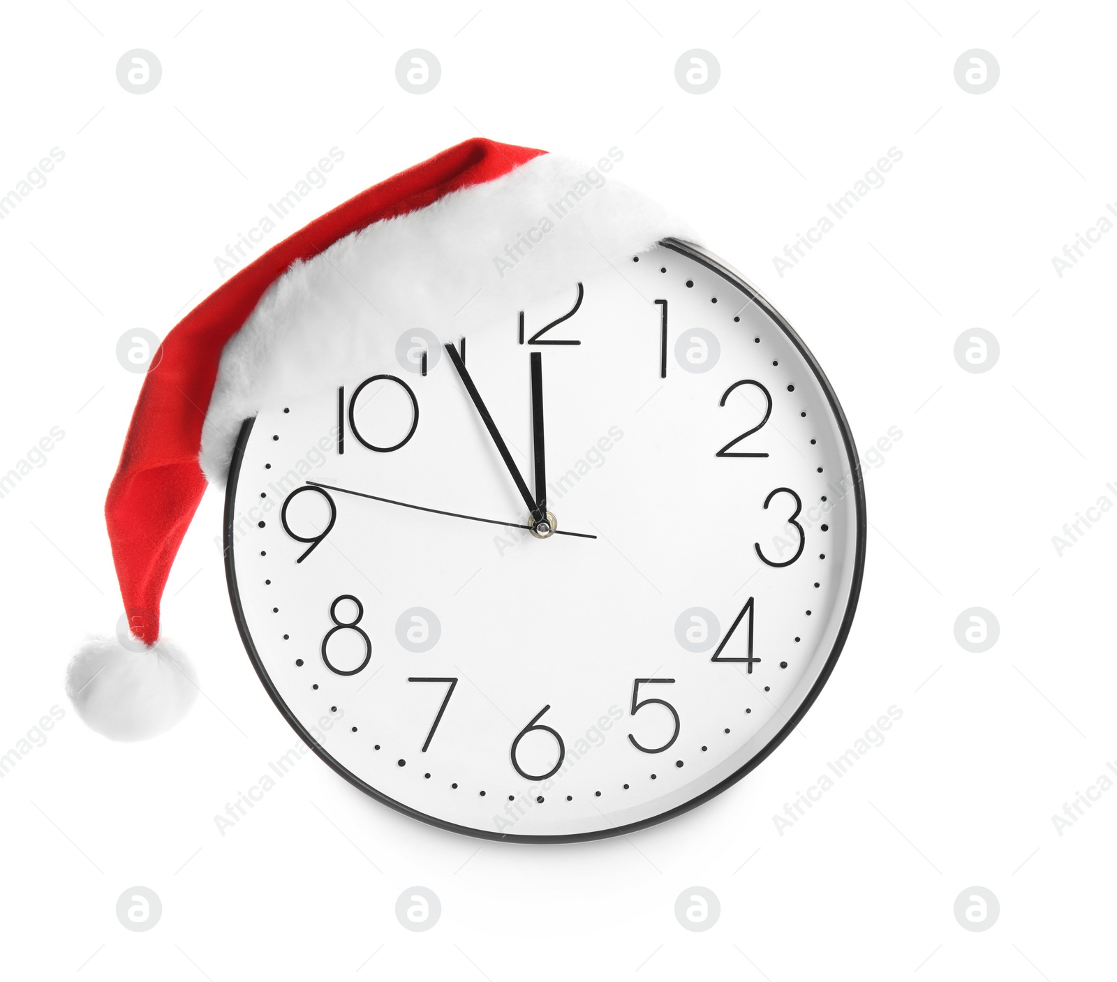 Photo of Clock with Santa hat showing five minutes until midnight on white background. New Year countdown