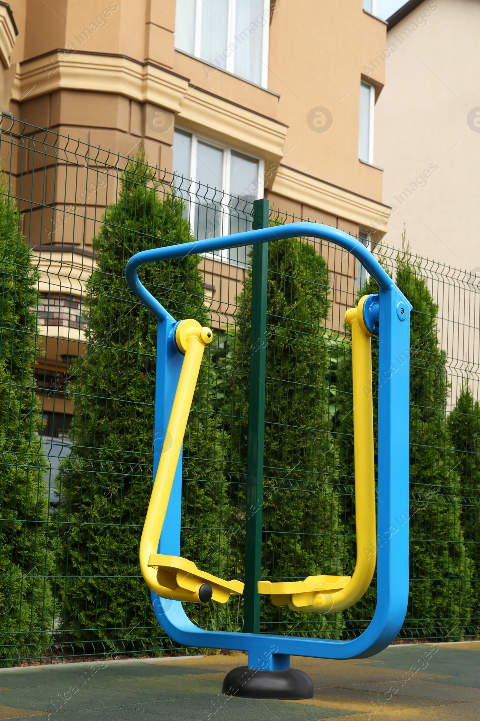 Photo of Empty outdoor playground with air walker in residential area