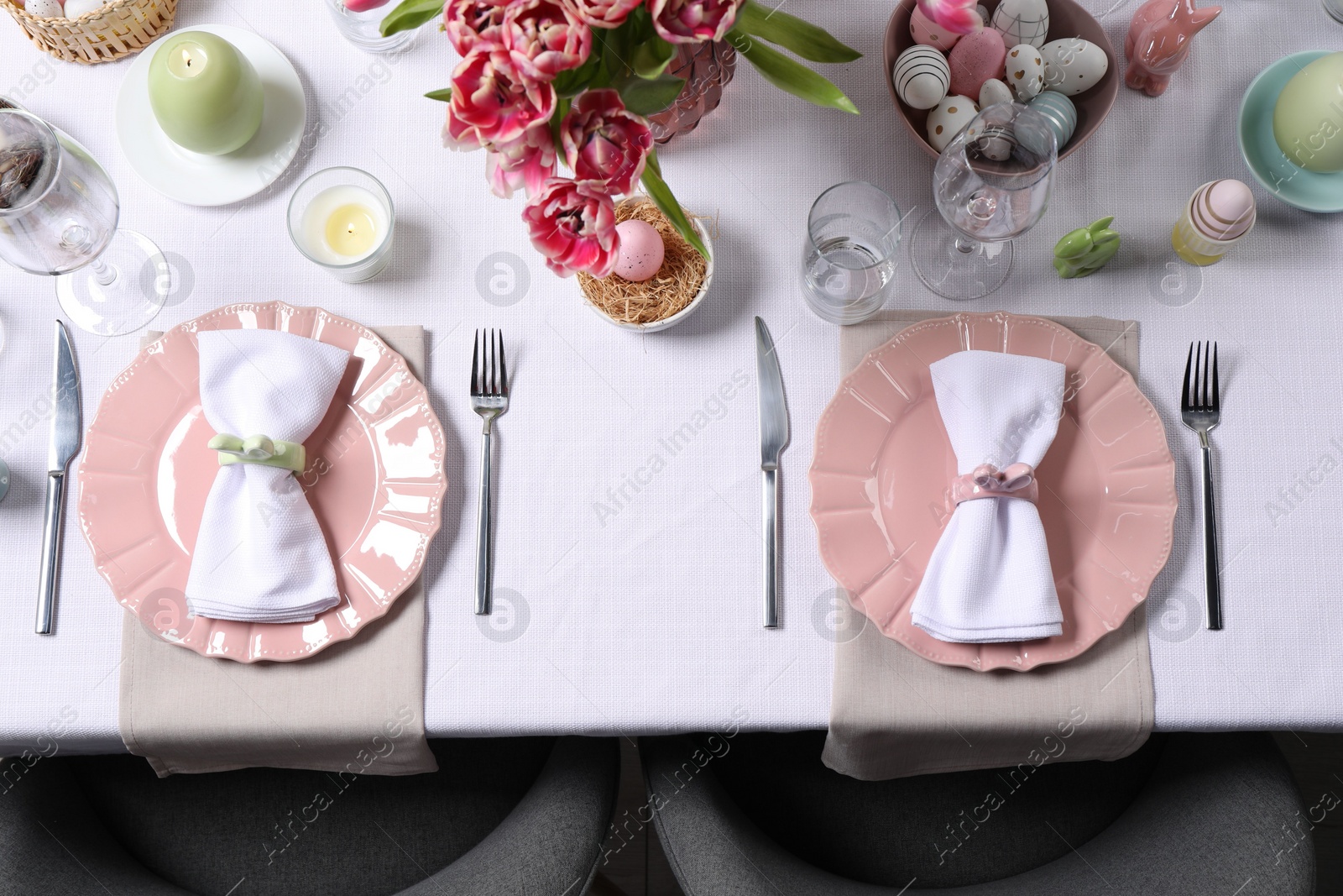 Photo of Festive table setting with beautiful flowers, top view. Easter celebration