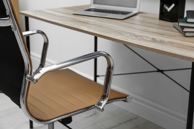Modern office chair in stylish workplace interior