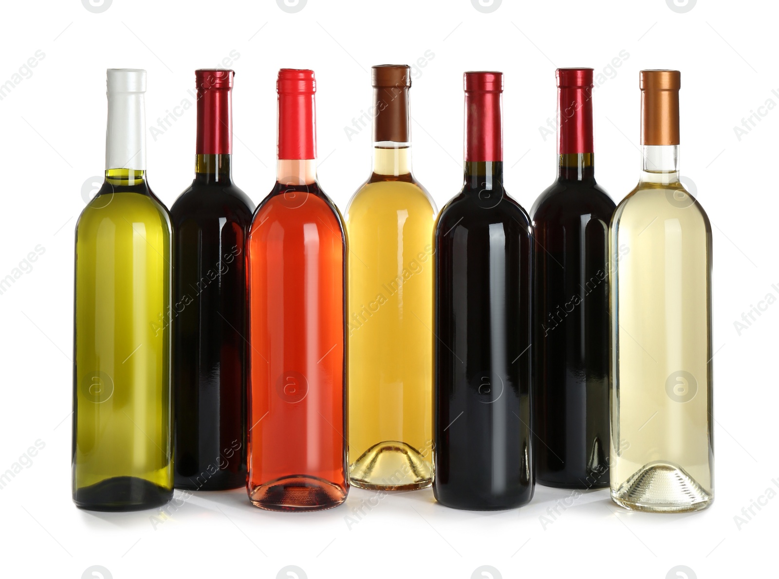 Photo of Bottles with different wine on white background