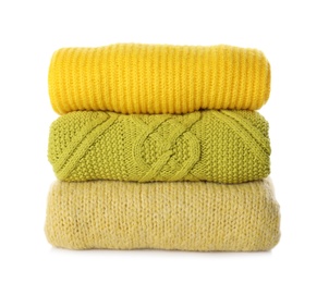 Photo of Stack of different warm sweaters isolated on white