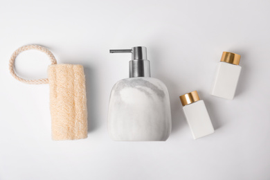 Photo of Flat lay composition with marble soap dispenser on white background