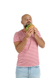 Overweight man with hamburger on white background