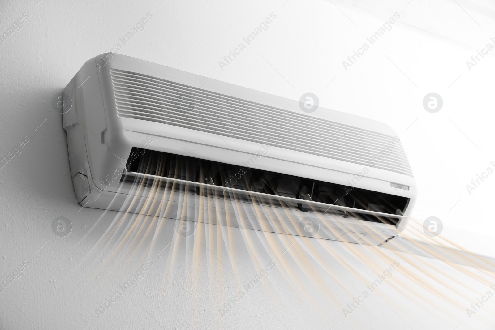 Image of Modern air conditioner on white wall indoors