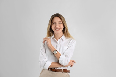 Photo of Portrait of beautiful young businesswoman on white background