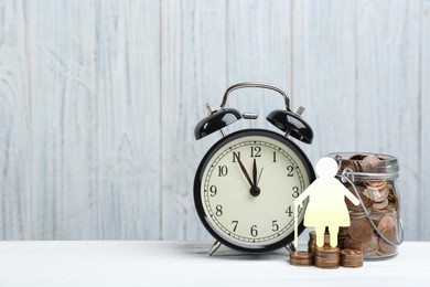 Image of Pension concept. Elderly woman illustration, coins and alarm clock on white wooden table. Space for text