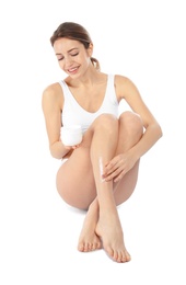 Young woman with jar of cream on white background. Beauty and body care