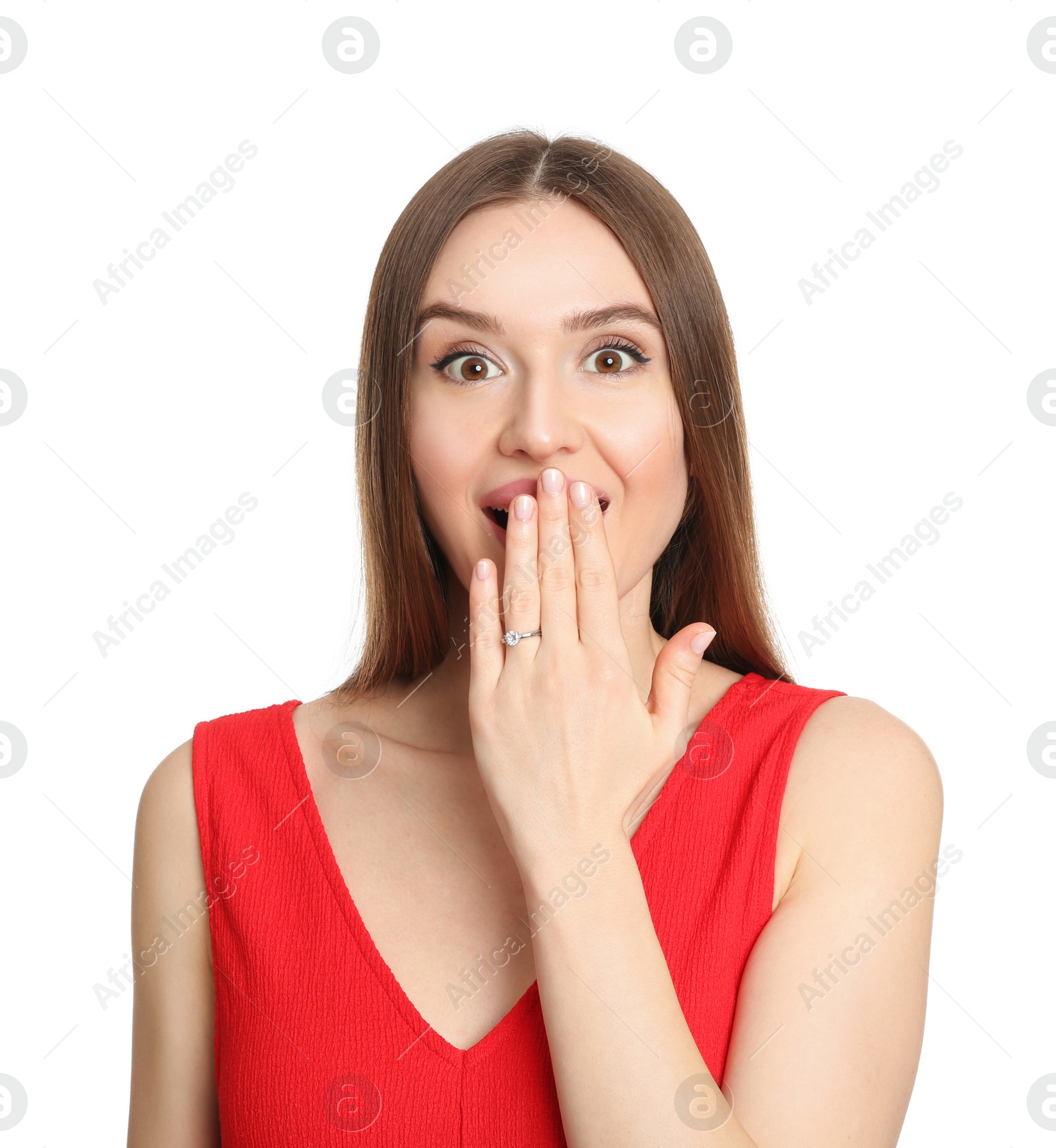 Photo of Emotional young woman wearing beautiful engagement ring on white background