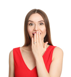 Emotional young woman wearing beautiful engagement ring on white background