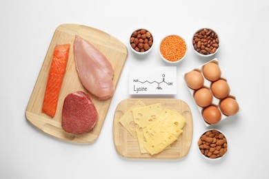 Different fresh products and paper with Lysine chemical formula on white background, top view. Sources of essential amino acids