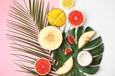 Photo of Flat lay composition with melon and other fruits on color background