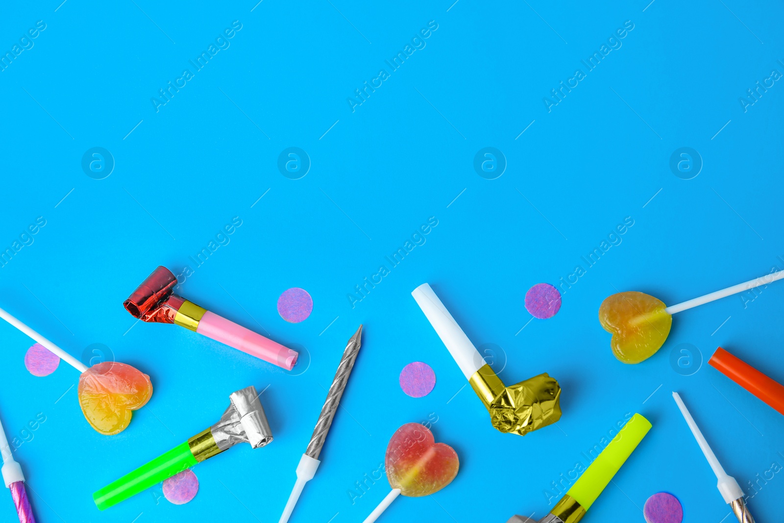 Photo of Many different party items on light blue background, flat lay. Space for text