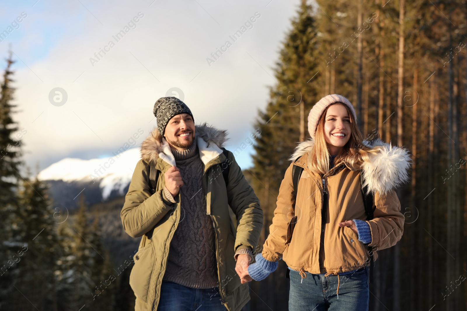 Photo of Happy couple spending winter vacation together in mountains