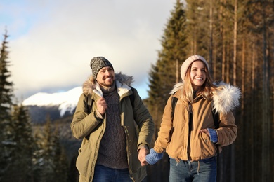 Photo of Happy couple spending winter vacation together in mountains