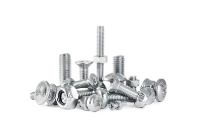 Photo of Different metal bolts and nuts on white background