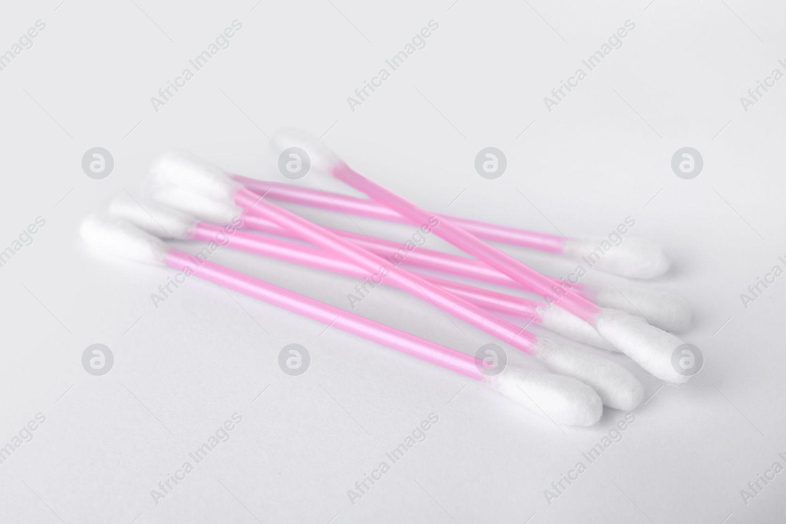 Photo of Clean cotton buds isolated on white. Hygienic product