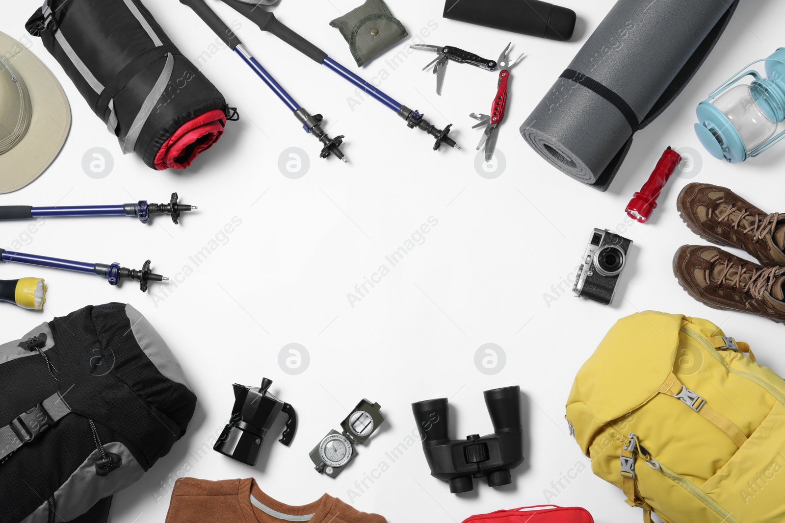 Photo of Flat lay composition with tourist backpack and camping equipment on white background, space for text