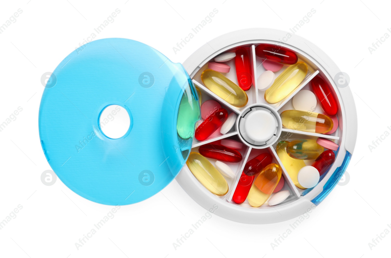 Photo of Different pills in organizer isolated on white, top view