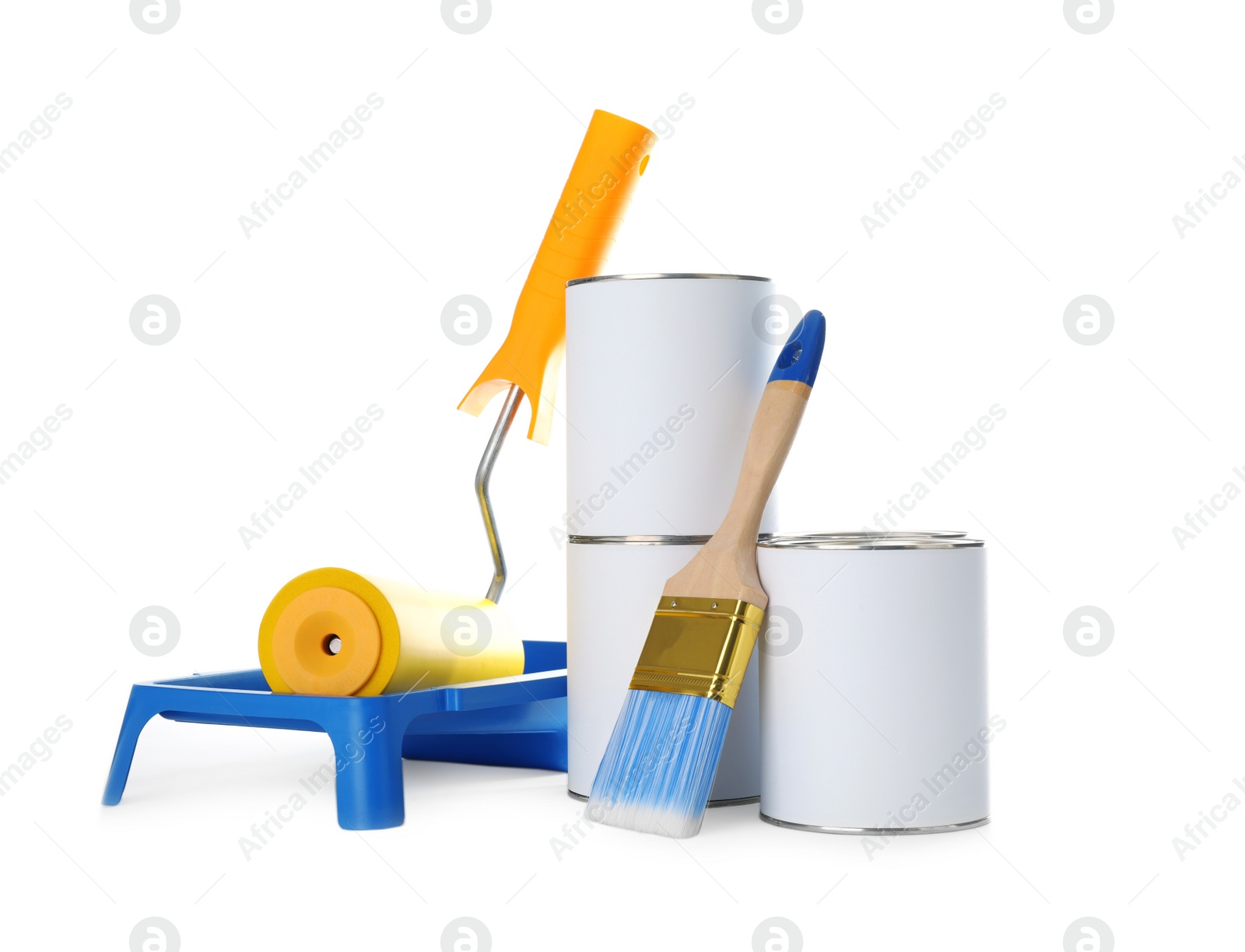 Photo of Closed blank cans of paint with brush, roller and tray isolated on white