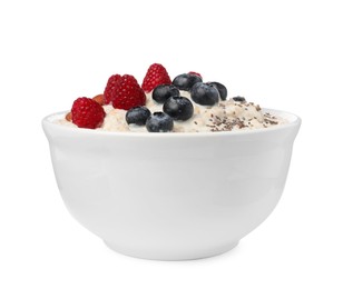 Photo of Tasty boiled oatmeal with berries, almonds and chia seeds in bowl isolated on white