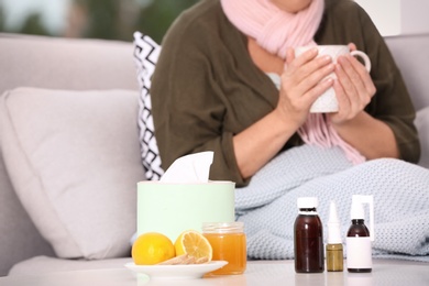 Photo of Different cough remedies and ill woman on background