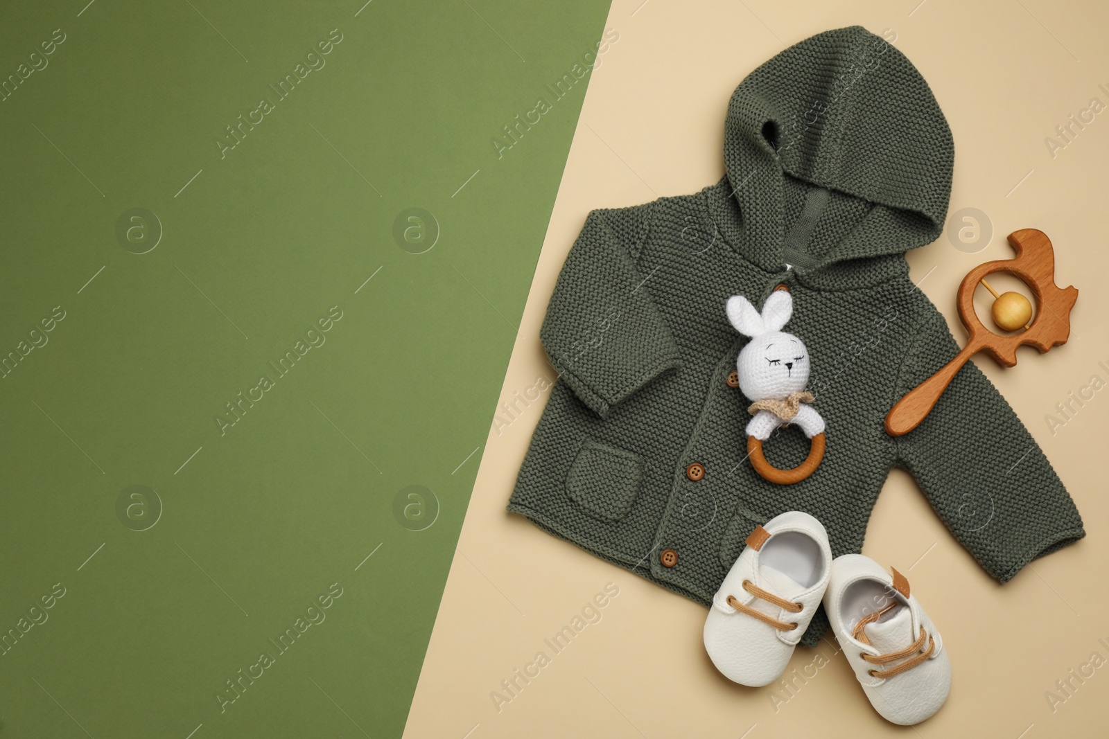 Photo of Flat lay composition with baby clothes and accessories on color background. Space for text