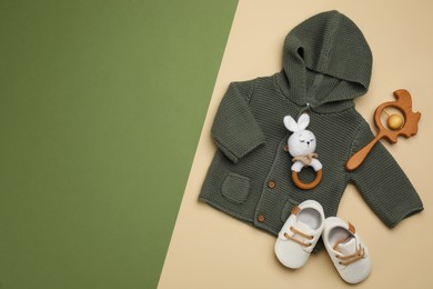 Flat lay composition with baby clothes and accessories on color background. Space for text