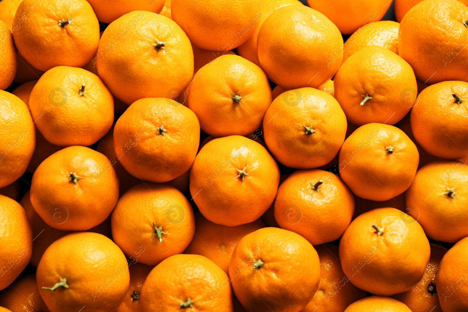 Photo of Delicious fresh ripe tangerines as background, top view