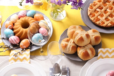 Festive Easter table setting with traditional meal, above view